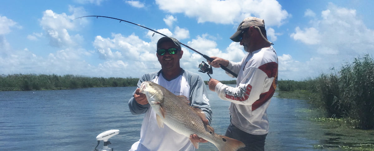 Redfish on the boat another on the line